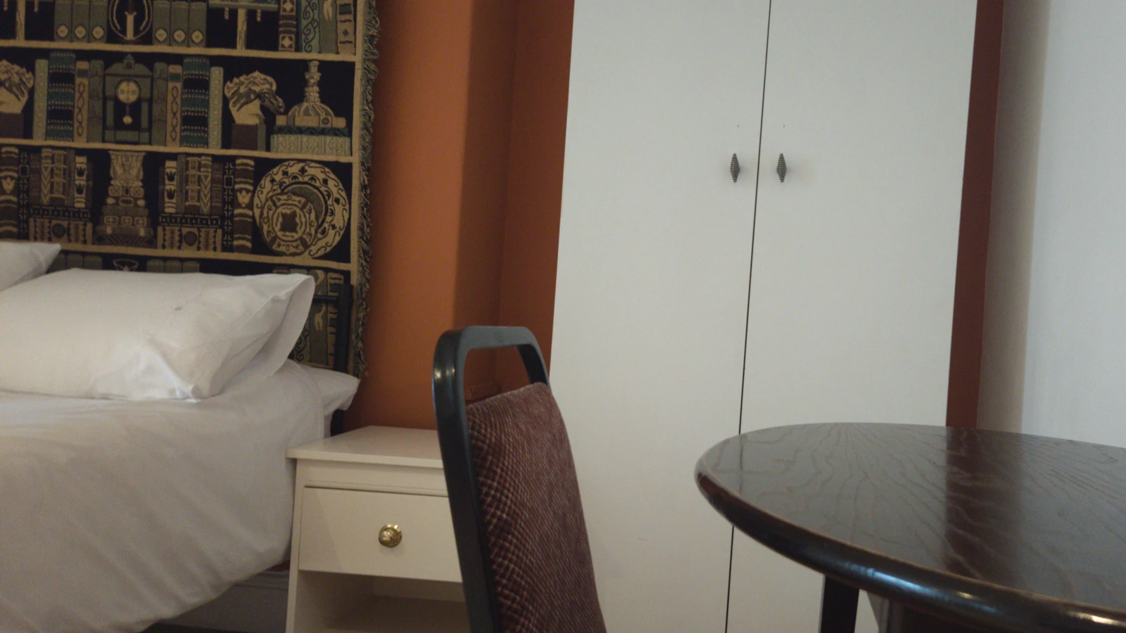 Wardrobe, table and chair in the room
