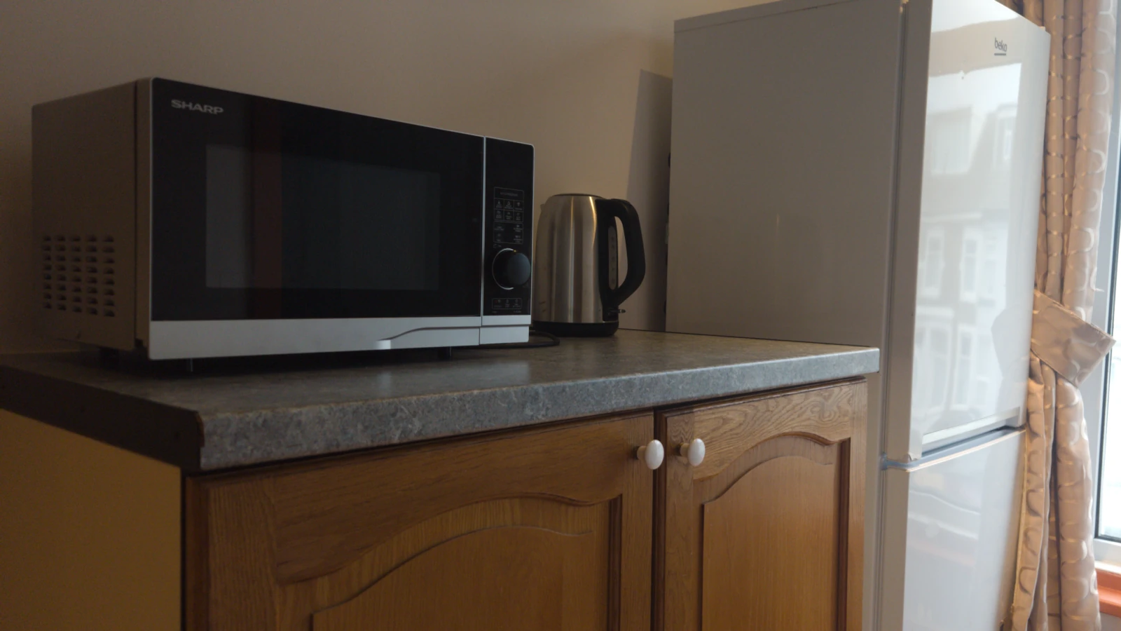 Kitchenette with fridge-freezer, microwave and kettle